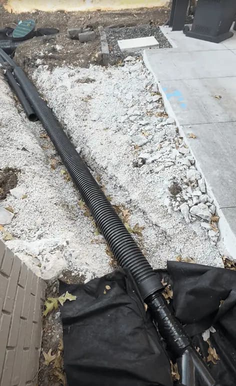 Drainage sleeve under concrete driveway - Kansas City